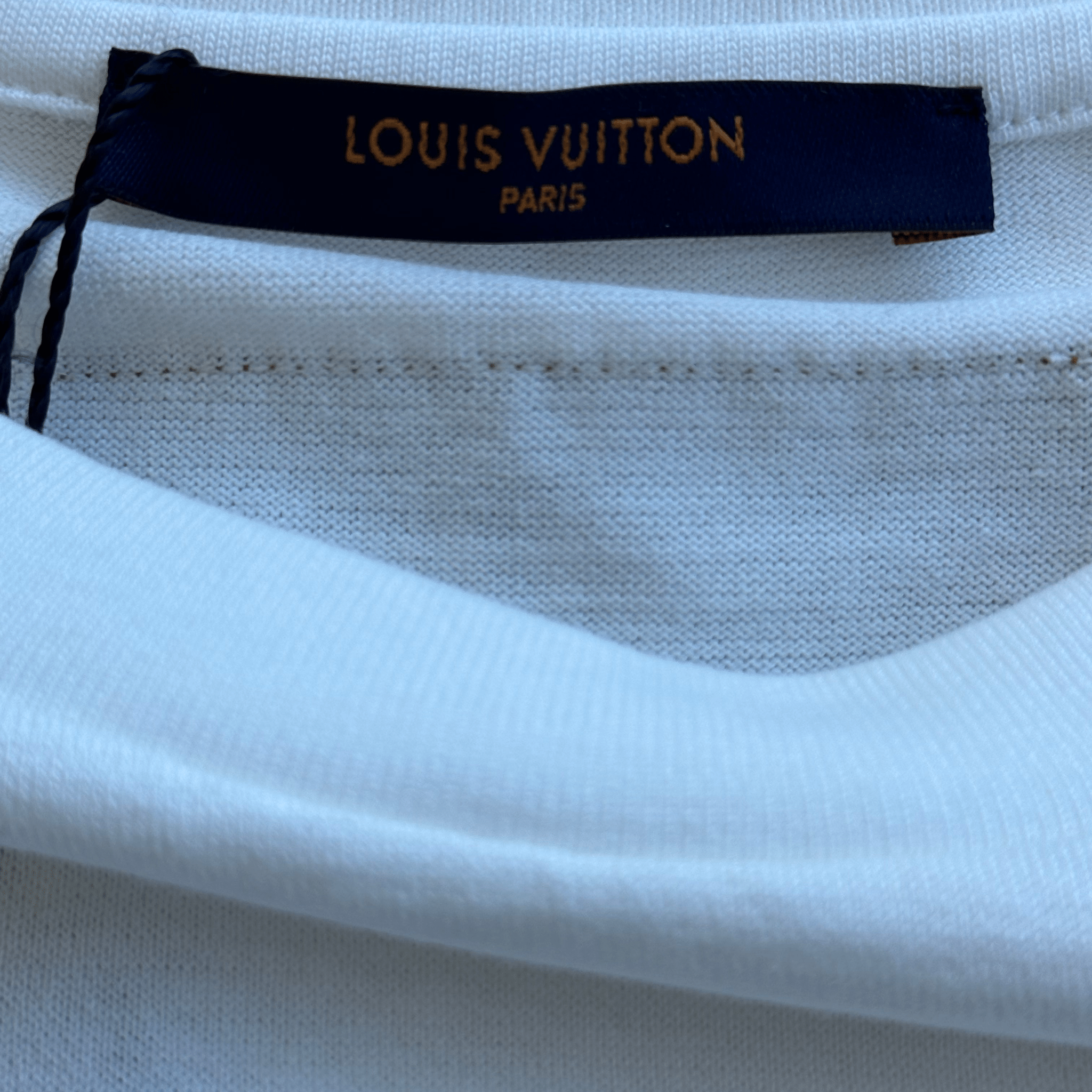 Louis Vuitton White & Blue LV Stitch Logo T-Shirt - Morely TrendsLouis Vuitton Type here:)