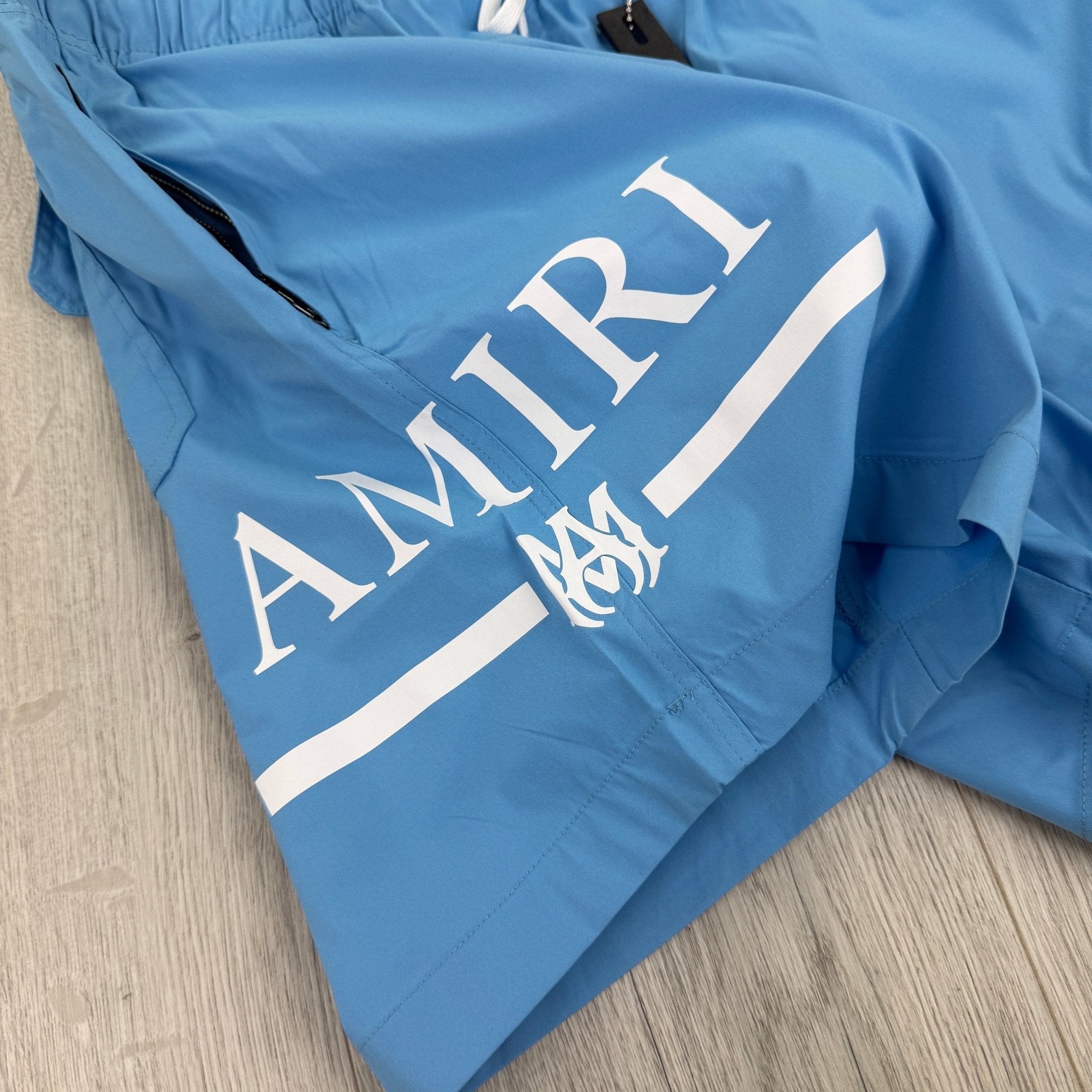 Amiri Men’s Baby Blue Swim Shorts - Morely TrendsAmiri Type here:)