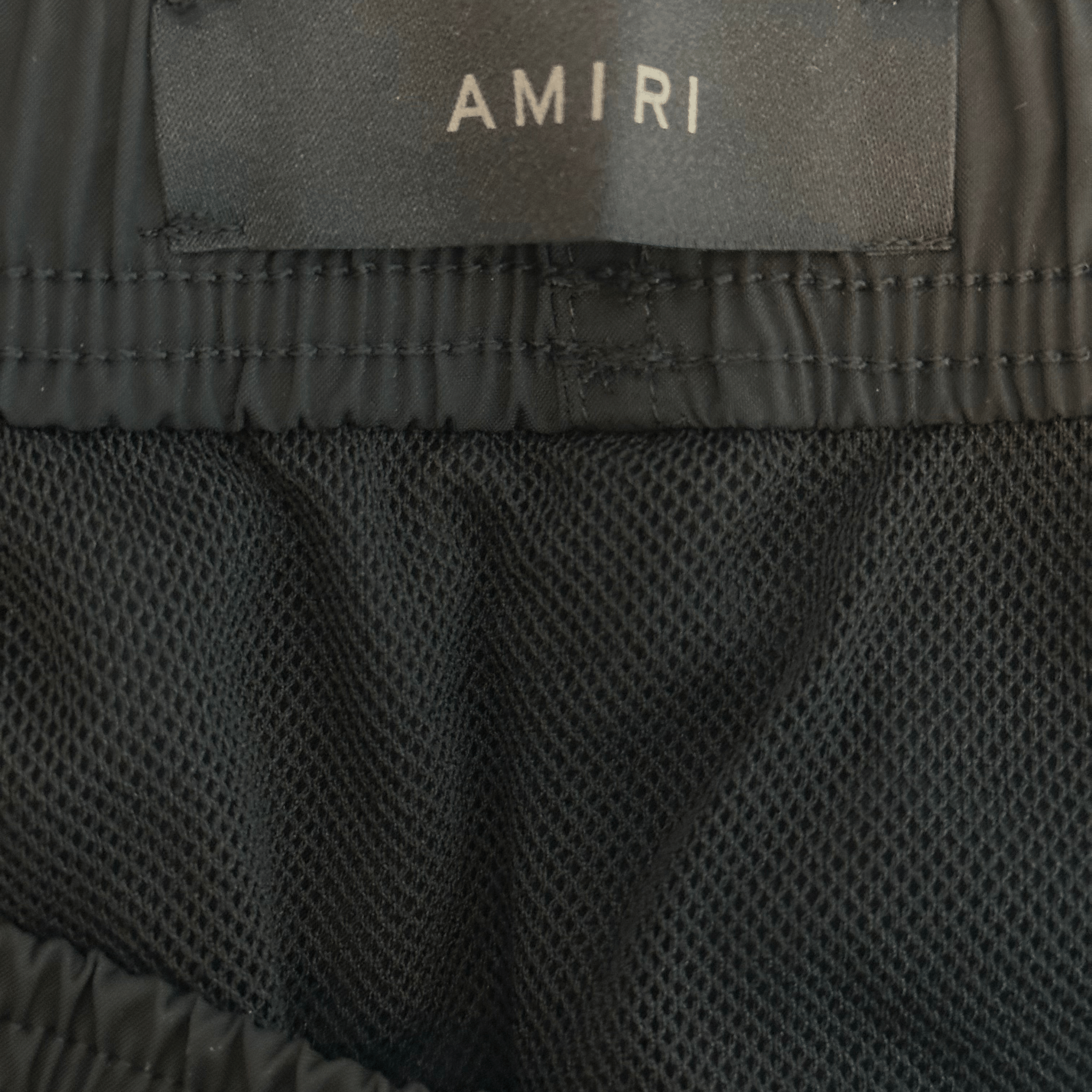 Amiri Black & White Stack Logo Swimshorts - Morely TrendsAmiri Type here:)
