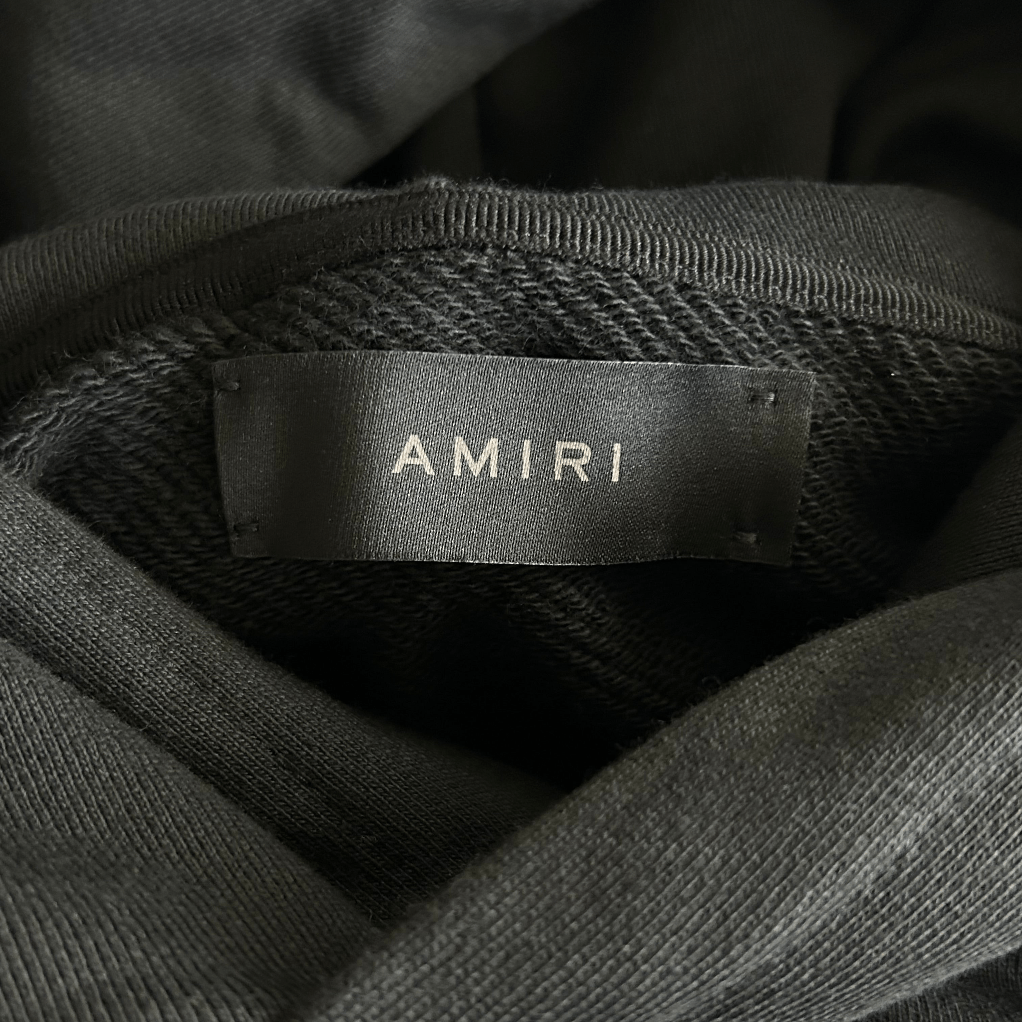 Amiri Black & Chrome Staggered Logo Hoodie - Morely TrendsAmiri Type here:)