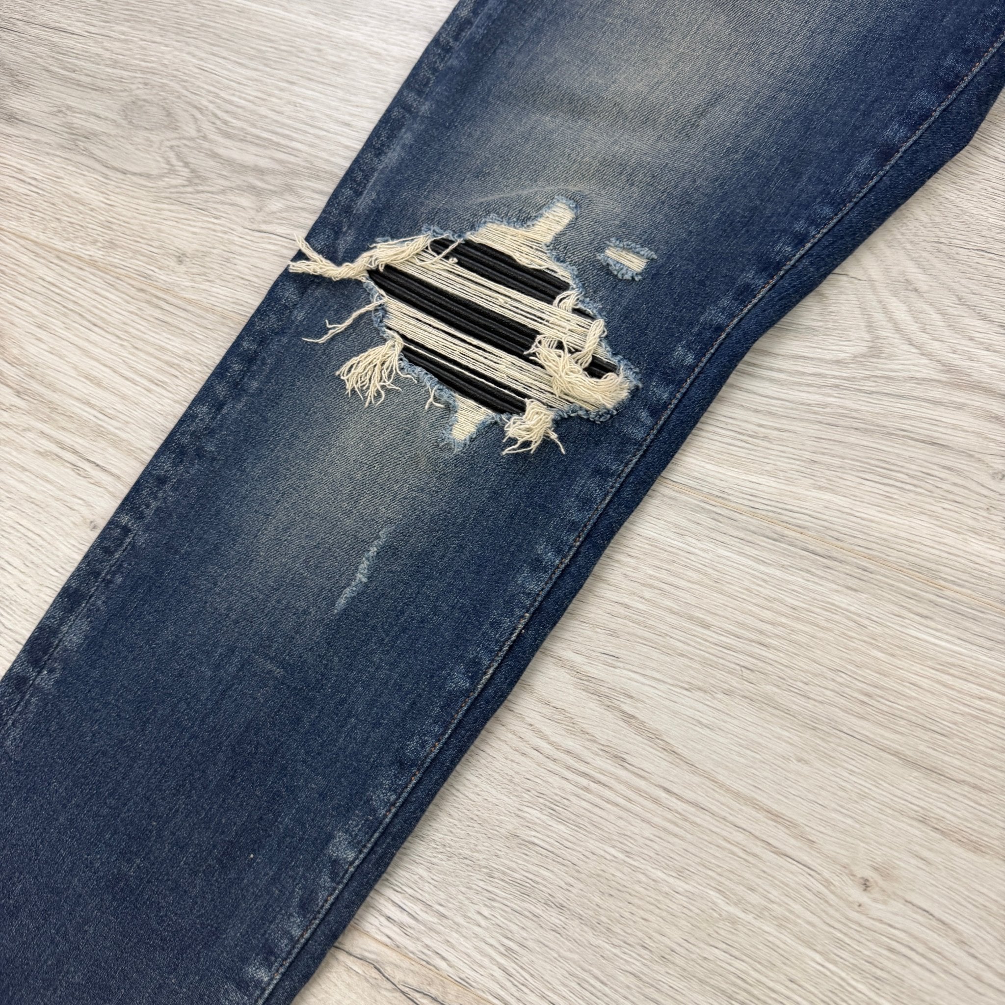 Amiri Men’s Blue MX1 Distressed Ripped Jeans - Morely TrendsAmiri Type here:)