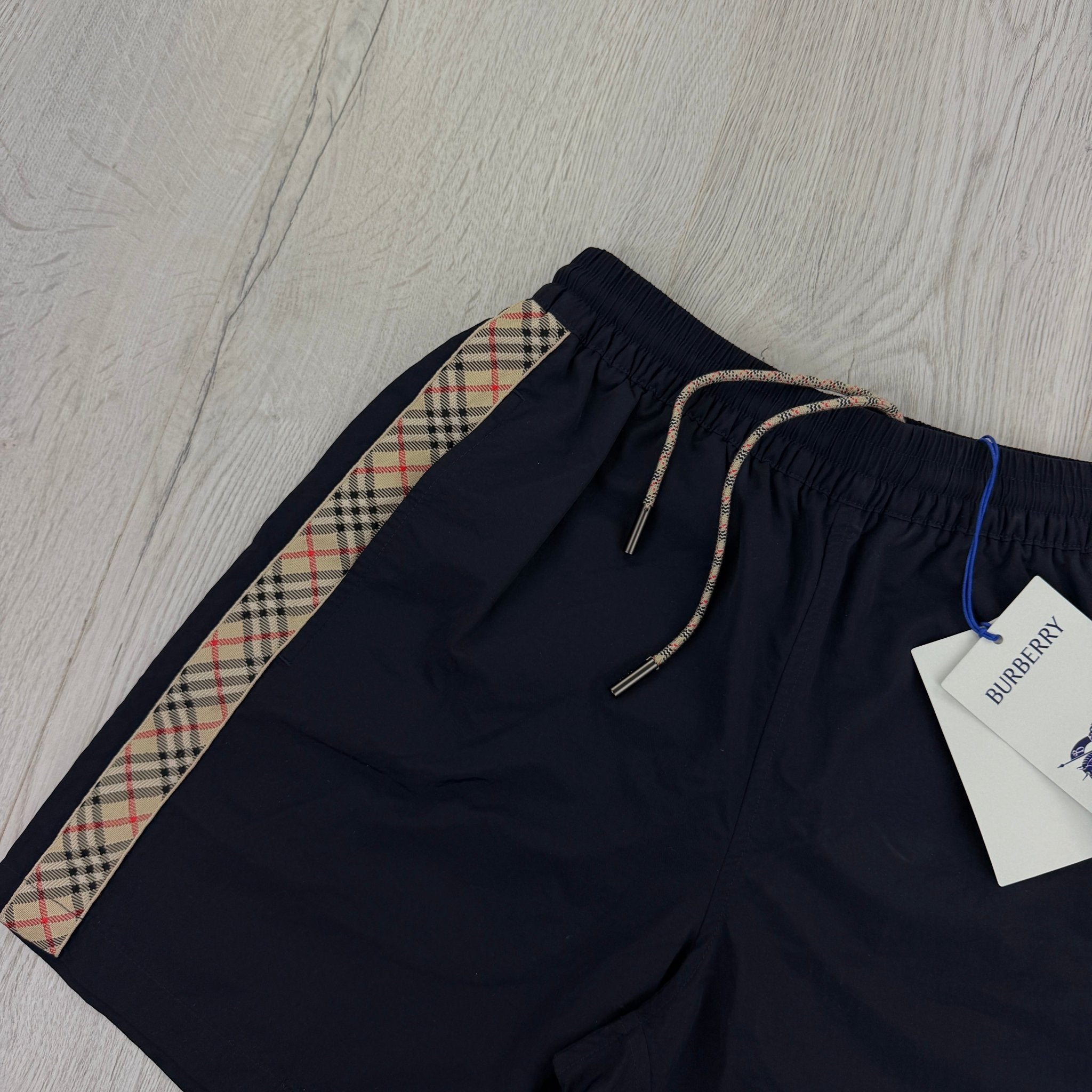Burberry Men’s Navy Swim Shorts - Morely TrendsBurberry Type here:)