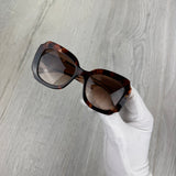 Prada Women’s Opaque Gradient Dark Brown Lenses Sunglasses
