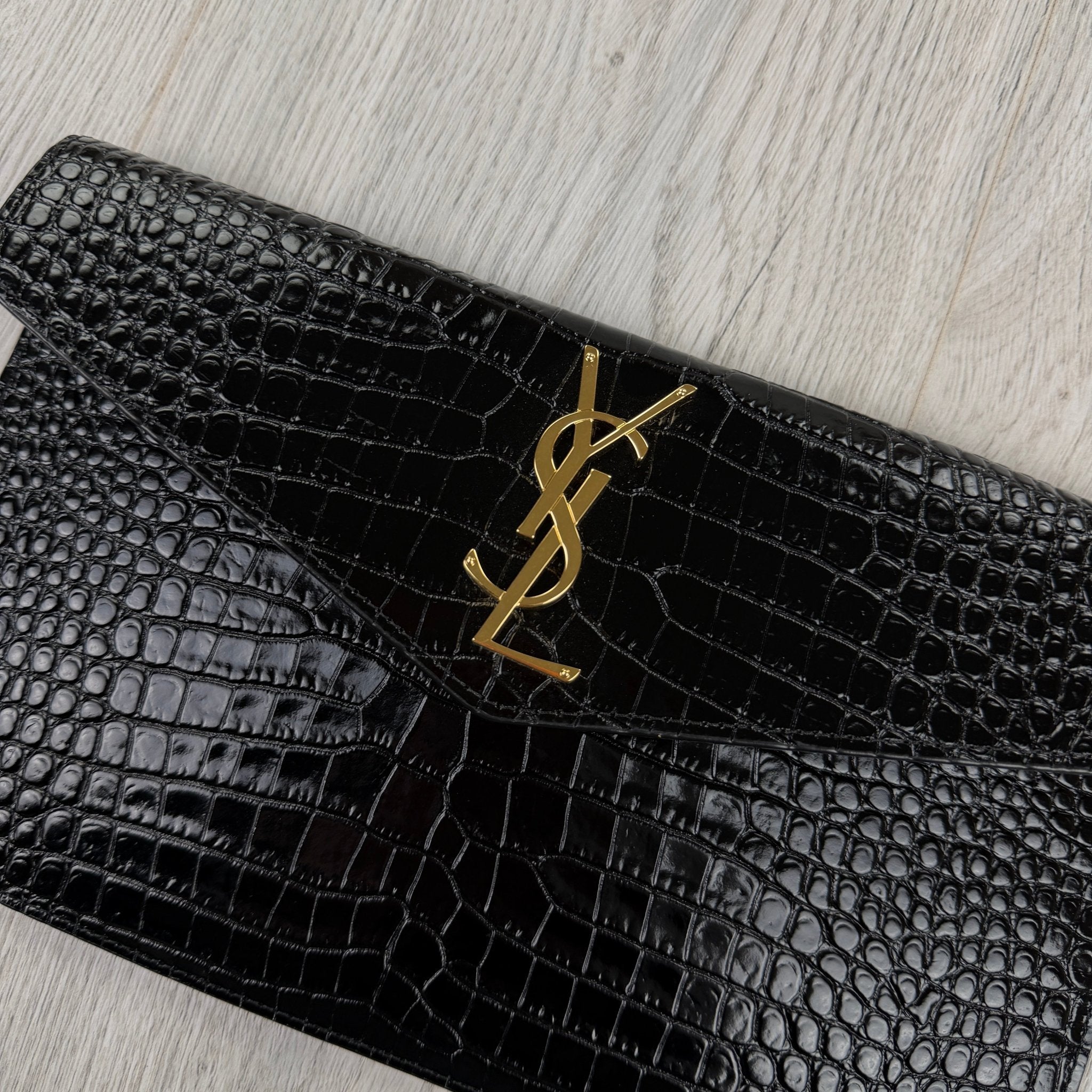 Saint Laurent Women’s Black Crock Clutch Bag - Morely TrendsSaint Laurent Type here:)