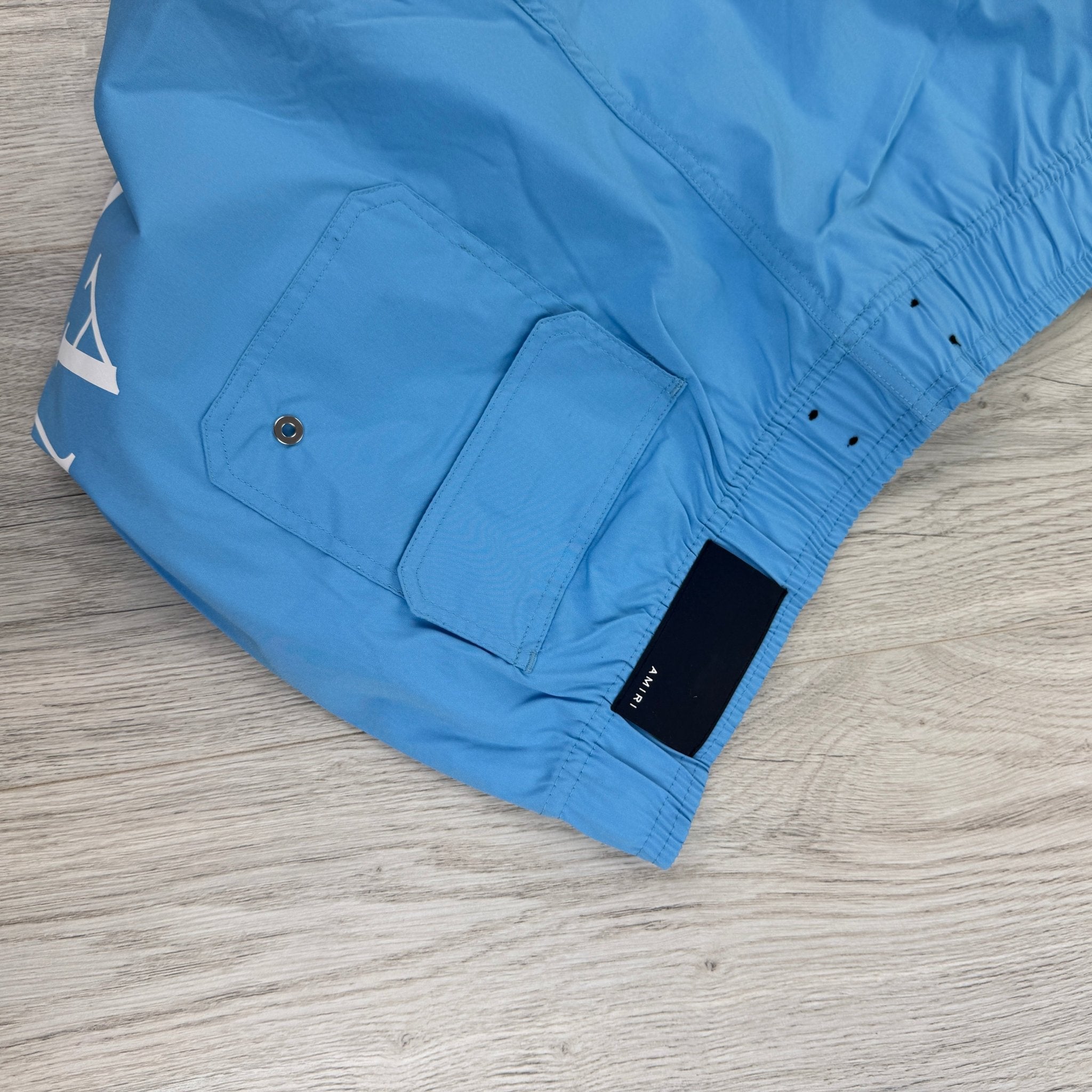 Amiri Men’s Baby Blue Swim Shorts - Morely TrendsAmiri Type here:)