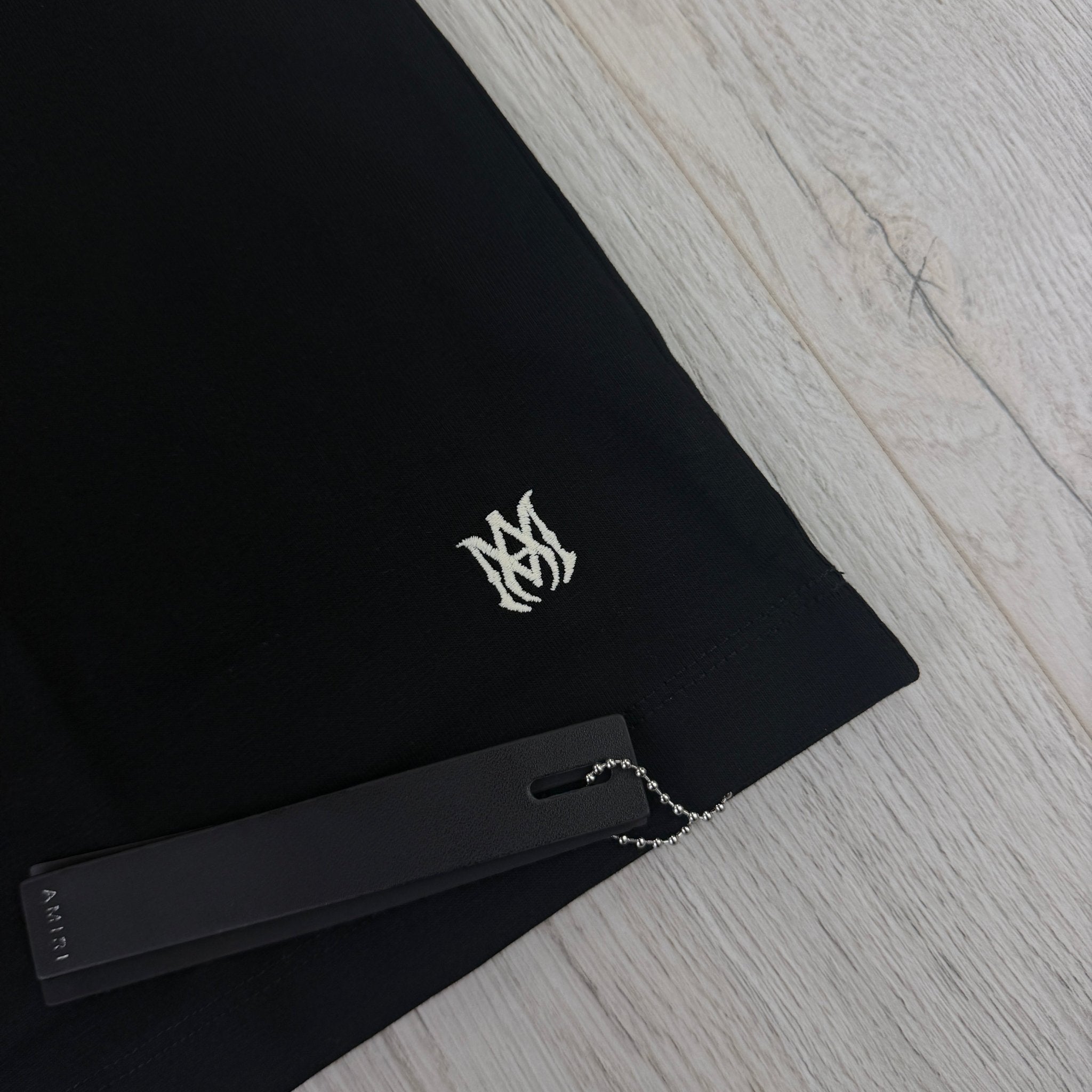Amiri Men’s Black T-shirt With White Logo - Morely TrendsAmiri Type here:)