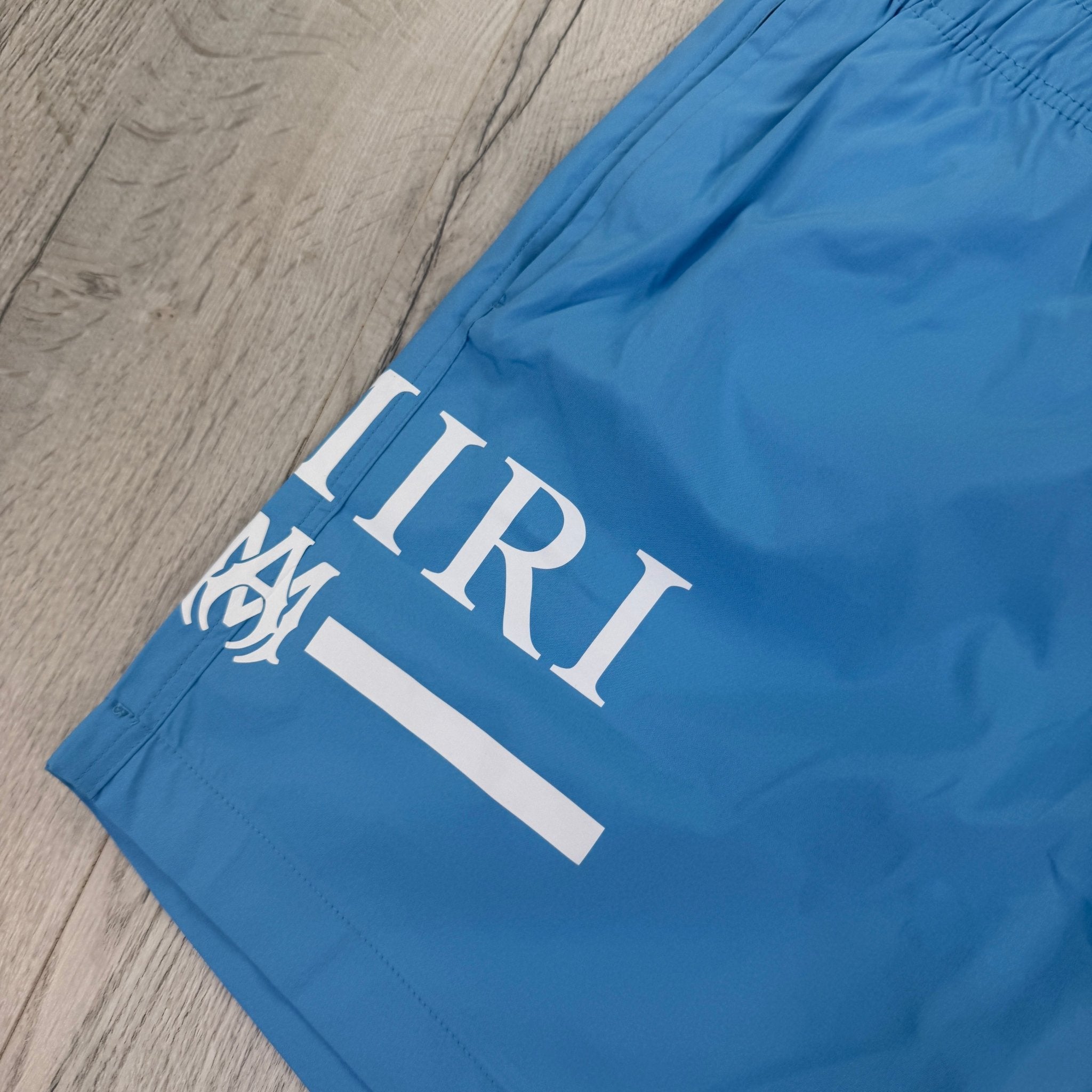 Amiri Men’s Baby Blue Swim Shorts - Morely TrendsAmiri Type here:)