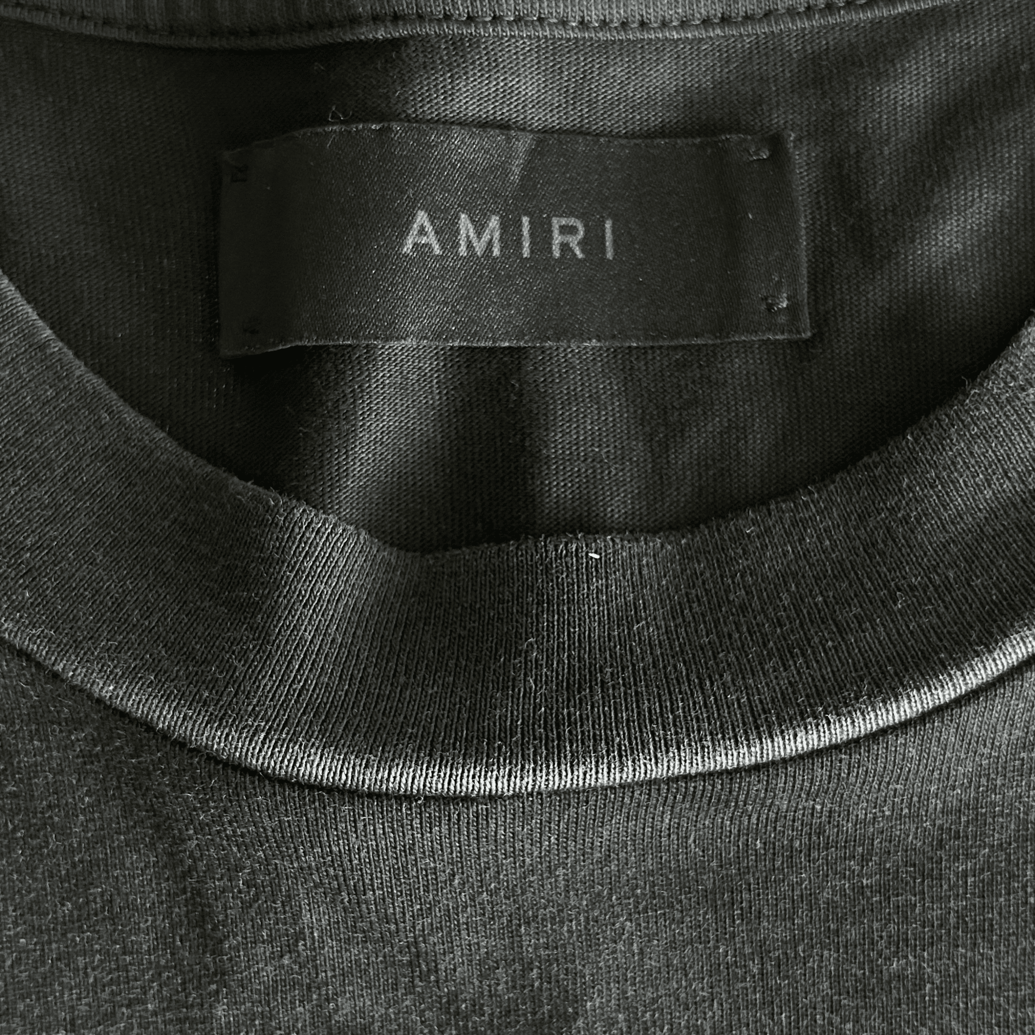 Amiri Faded Black & White Lounge Graphic T-Shirt - Morely TrendsAmiri Type here:)