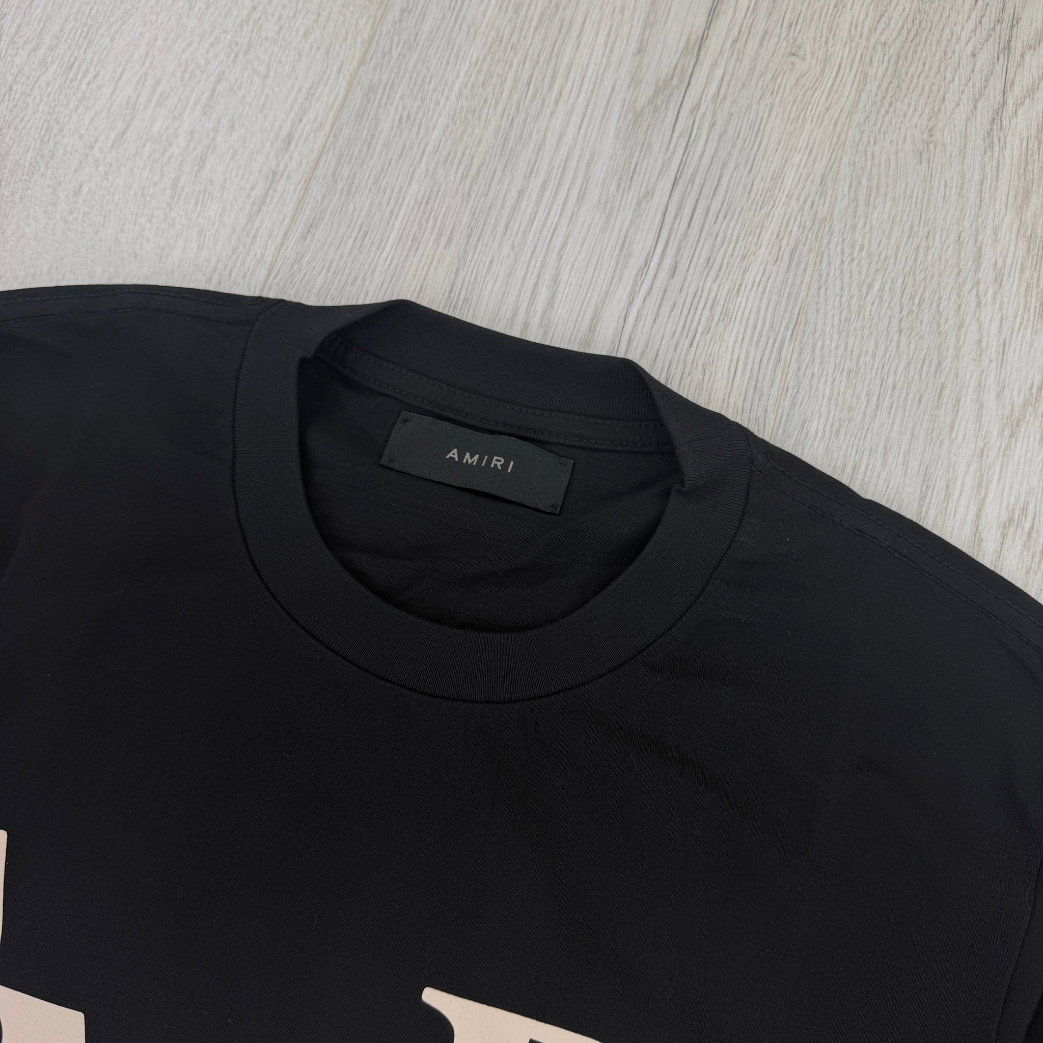 Amiri Men’s Black T-shirt With White Logo - Morely TrendsAmiri Type here:)