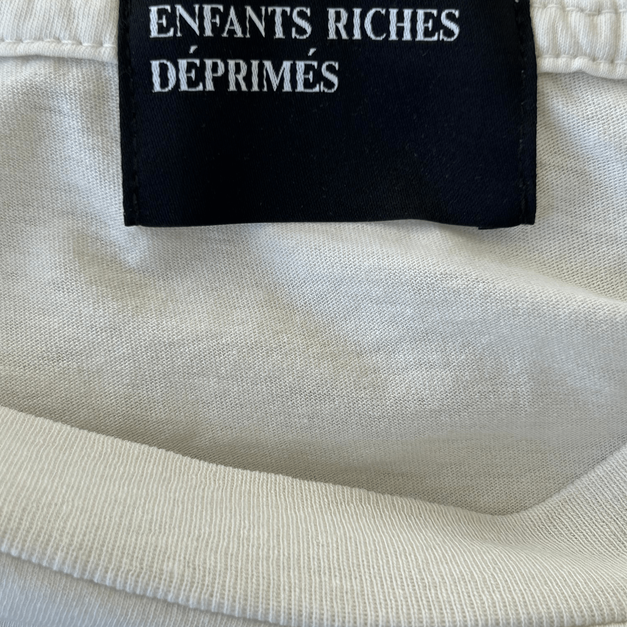 Enfants Riches Deprimes White & Black S*x Related Crimes Graphic T-Shirt - Morely TrendsEnfants Riches Deprimes Type here:)